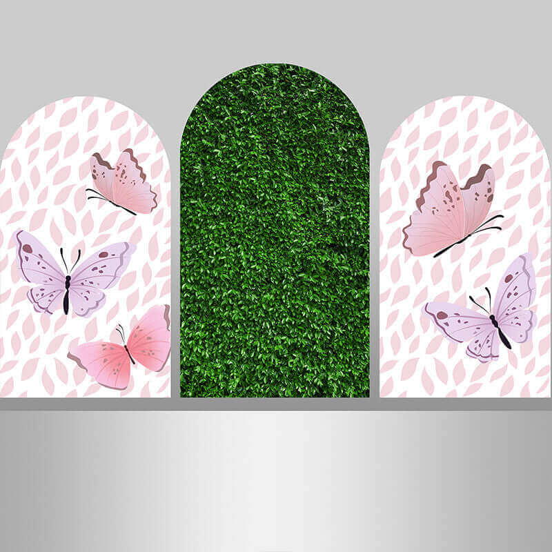 Three-piece arched backdrop set with pink butterfly side arches and a lush green grass center arch, perfect for garden-themed or nature-inspired events.