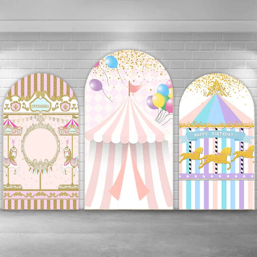 Three-panel carnival-themed arched backdrop set with a golden carousel, a pink circus tent, and a pastel carousel featuring golden horses and a 'Happy Birthday' banner.