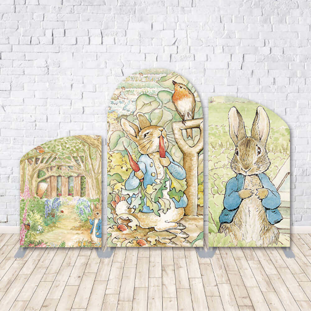 Easter rabbit-themed arched backdrop set featuring watercolor illustrations of Peter Rabbit, lush gardens, and nature elements. Perfect for springtime, Easter, and children’s events.