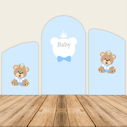 Three-panel blue arched backdrop featuring crowned teddy bears on the left and right panels, with a central arch displaying a "Baby" design, all set against a wooden floor background.