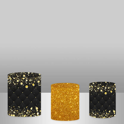 Set of three cylinder covers for black-and-gold party decor: two with black and gold glitter designs and one in solid gold glitter.