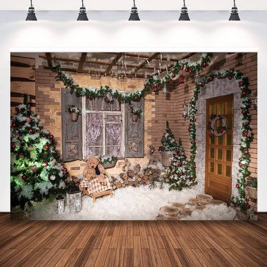 Holiday backdrop featuring a rustic wooden window, wreath-adorned door, decorated Christmas trees, and winter decorations for portraits.