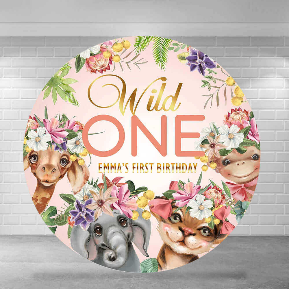 Wild One round backdrop featuring a soft pink background with floral accents and adorable jungle animals like a giraffe, elephant, tiger, and monkey, perfect for a first birthday celebration.