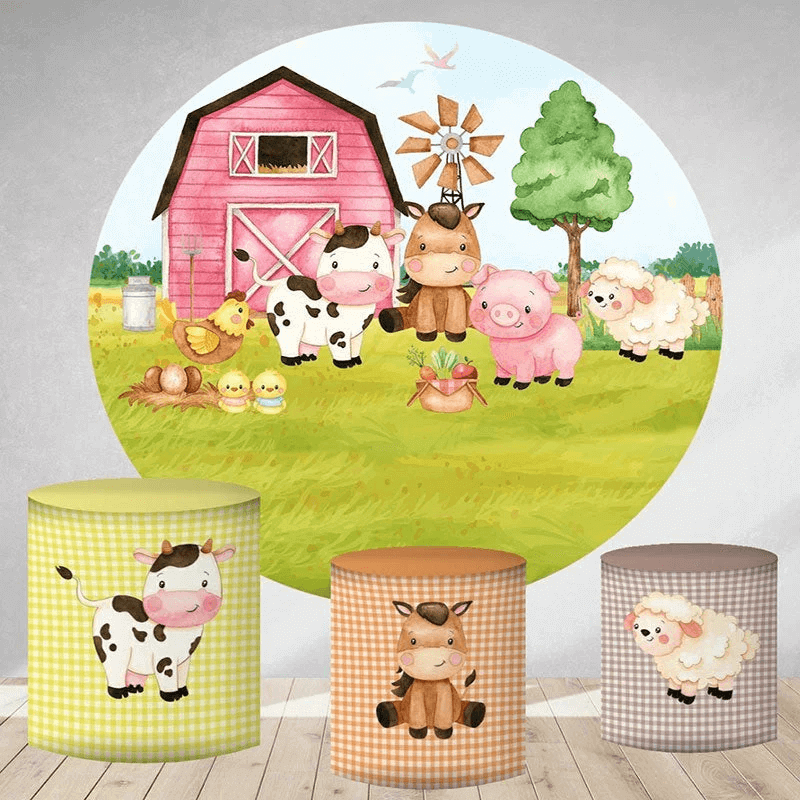 A farm-themed party decor set featuring a circular pink barn backdrop with cows, pigs, sheep, and chickens, and three cylinder covers with gingham patterns and farm animal illustrations.