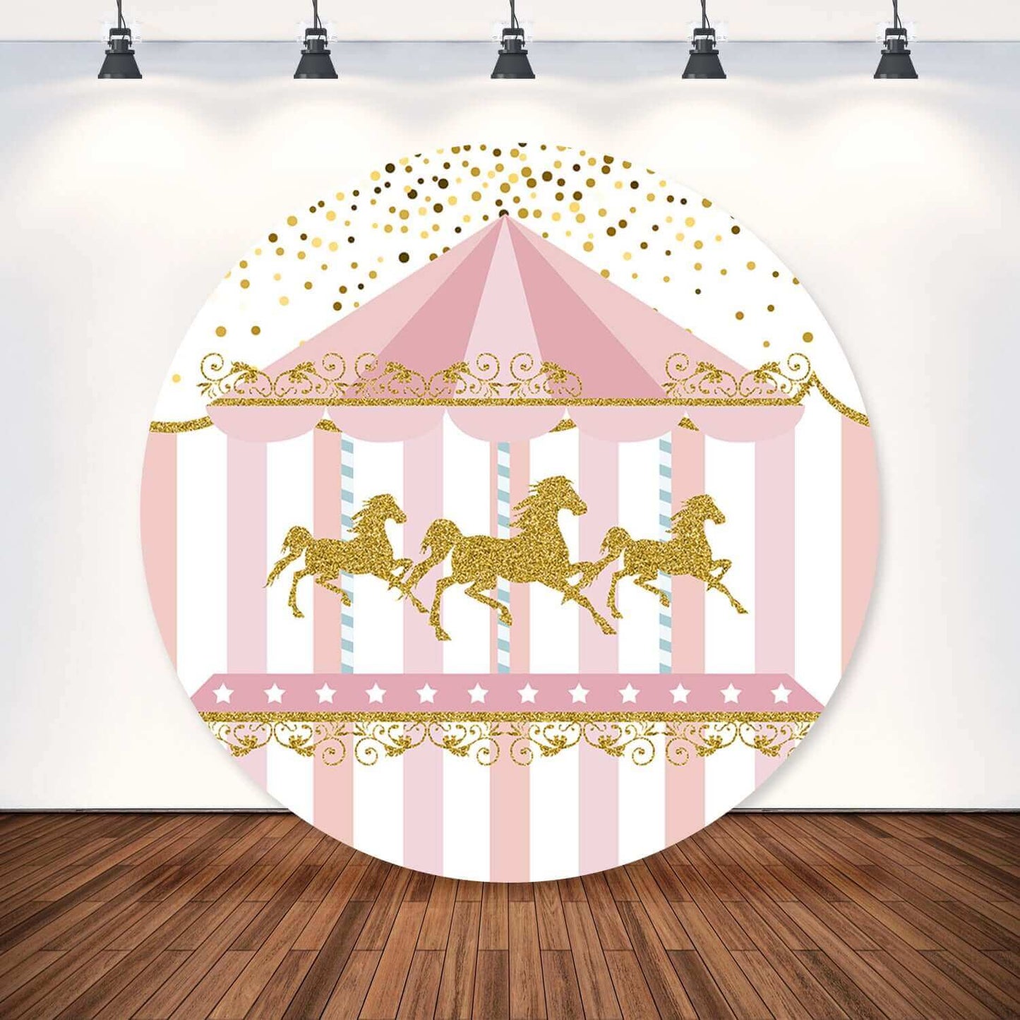 Pink carousel-themed birthday party backdrop featuring golden glitter horses, a striped tent, and whimsical gold dot accents.