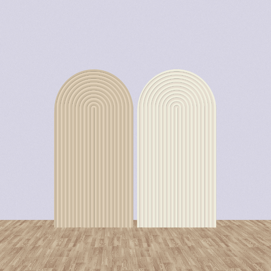 Set of two groovy arched backdrop panels in beige and cream tones, featuring a layered arch design on a wooden floor with a neutral purple background.