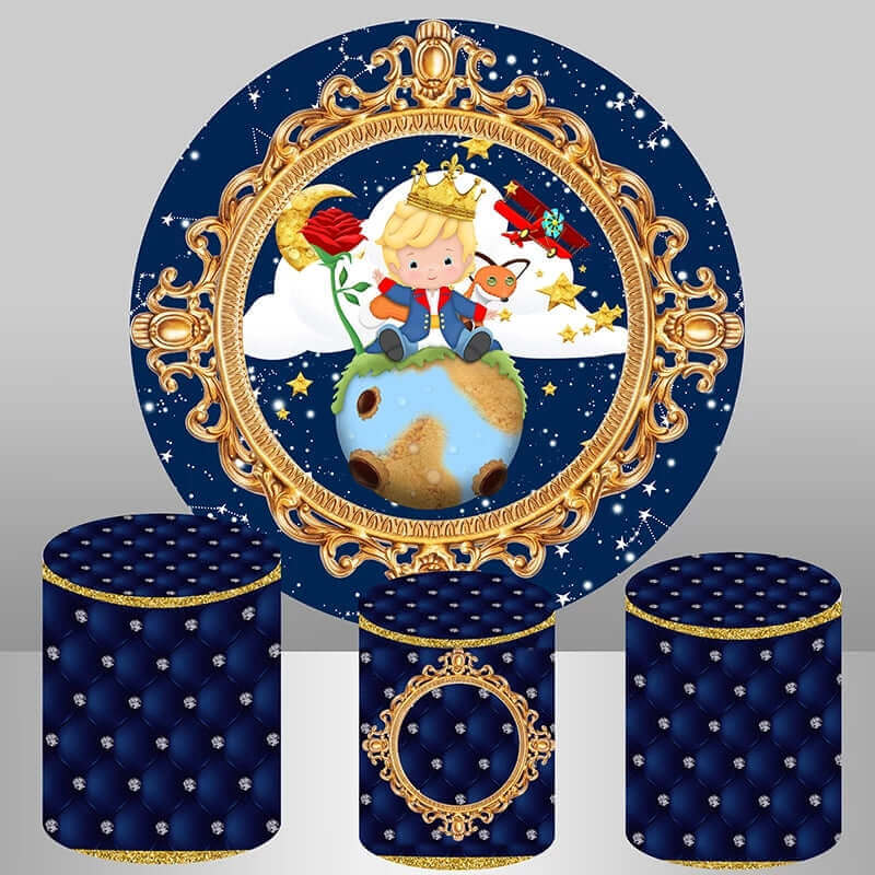 Little Prince-themed party backdrop with a golden frame, the little prince sitting on a planet with a rose and fox, a royal blue starry night background, and three matching tufted royal blue plinth covers with gold details.