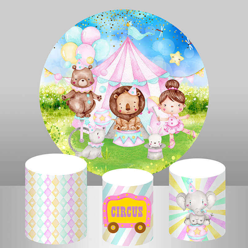 A circus-themed party decor set featuring a round backdrop with cartoon animals and a pink circus tent, along with three matching cylinder covers with pastel patterns and circus designs.