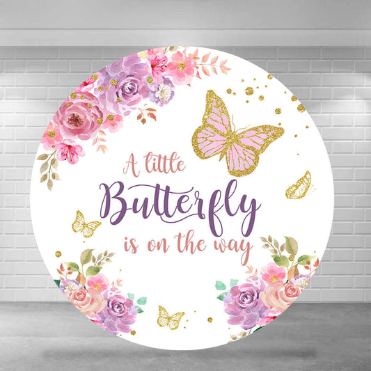 Round baby shower-themed backdrop with pink and purple flowers, gold butterflies, and the text 'A Little Butterfly is on the Way.