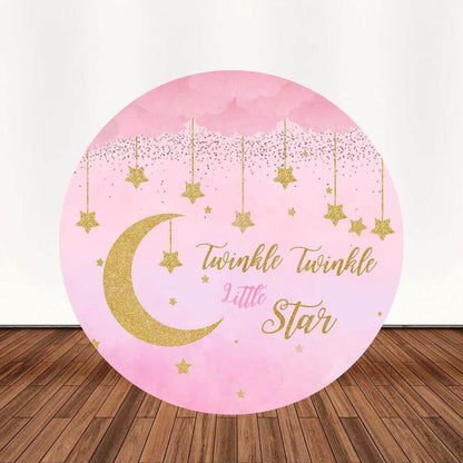 A round pink and gold "Twinkle Twinkle Little Star" backdrop with golden stars, moons, and the phrase “Twinkle Twinkle Little Star,” perfect for girls' birthday parties or baby showers.