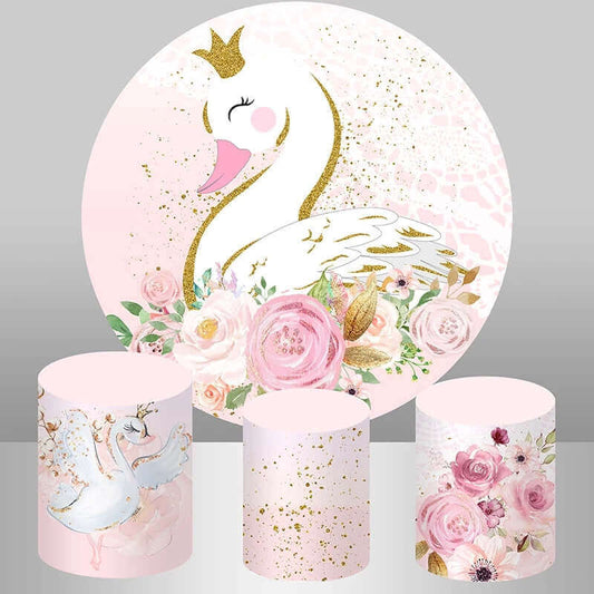 Swan-themed birthday party backdrop featuring a golden swan with a crown, pink floral accents, and gold splatter details, paired with three plinth covers in floral, gold splatter, and swan designs.