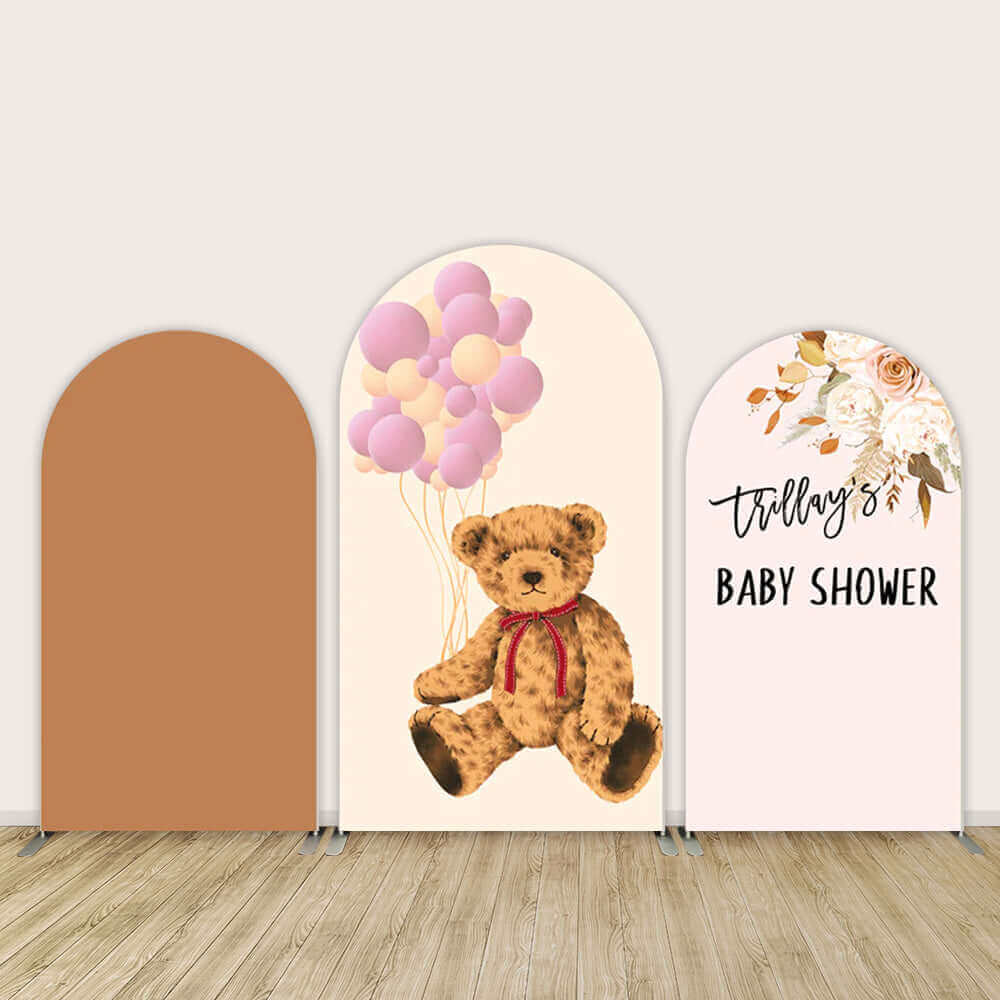 Set of three arch backdrops for a teddy bear and baby shower theme, featuring a neutral panel, a teddy bear with balloons, and a floral design with the text 'Trillay's Baby Shower'.