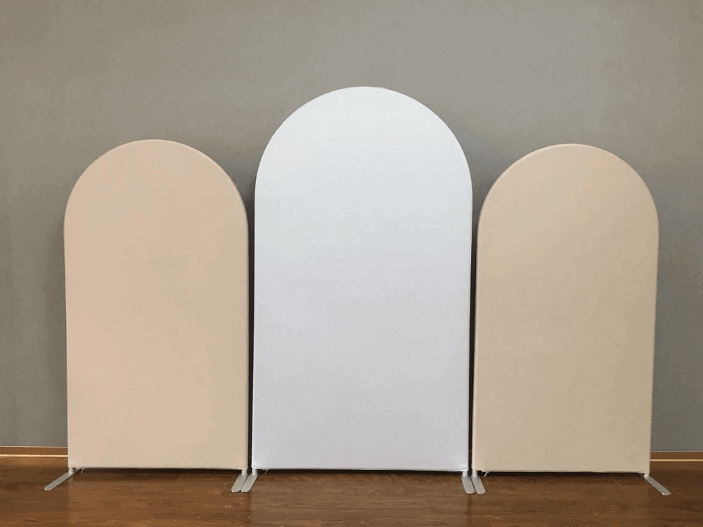 Set of three freestanding arched wall backdrop covers in white and nude tones, perfect for modern event decoration and styling.