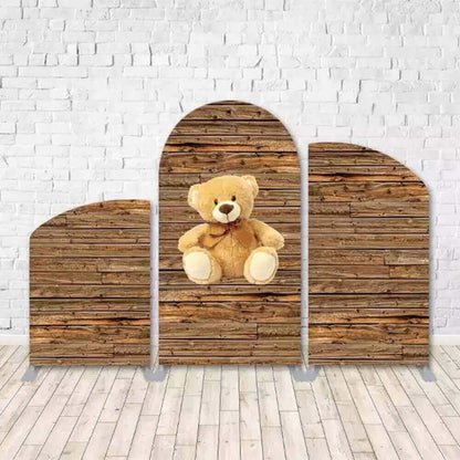 Three-piece rustic wooden arched backdrop set with a central teddy bear design, perfect for baby showers, kids’ birthdays, and woodland-themed celebrations.