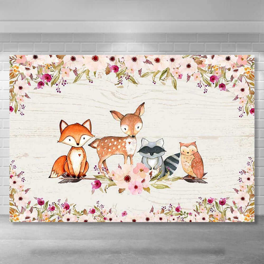 Woodland baby shower backdrop with a whitewashed wood background, watercolor fox, deer, raccoon, and owl illustrations surrounded by pink floral accents, perfect for rustic-themed celebrations.